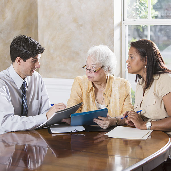 Senior woman getting advice from lawyer