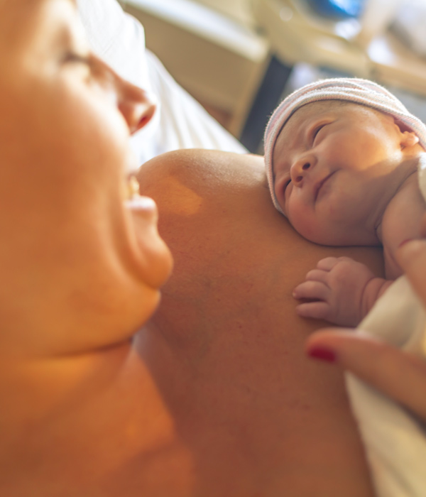 mother holding newborn